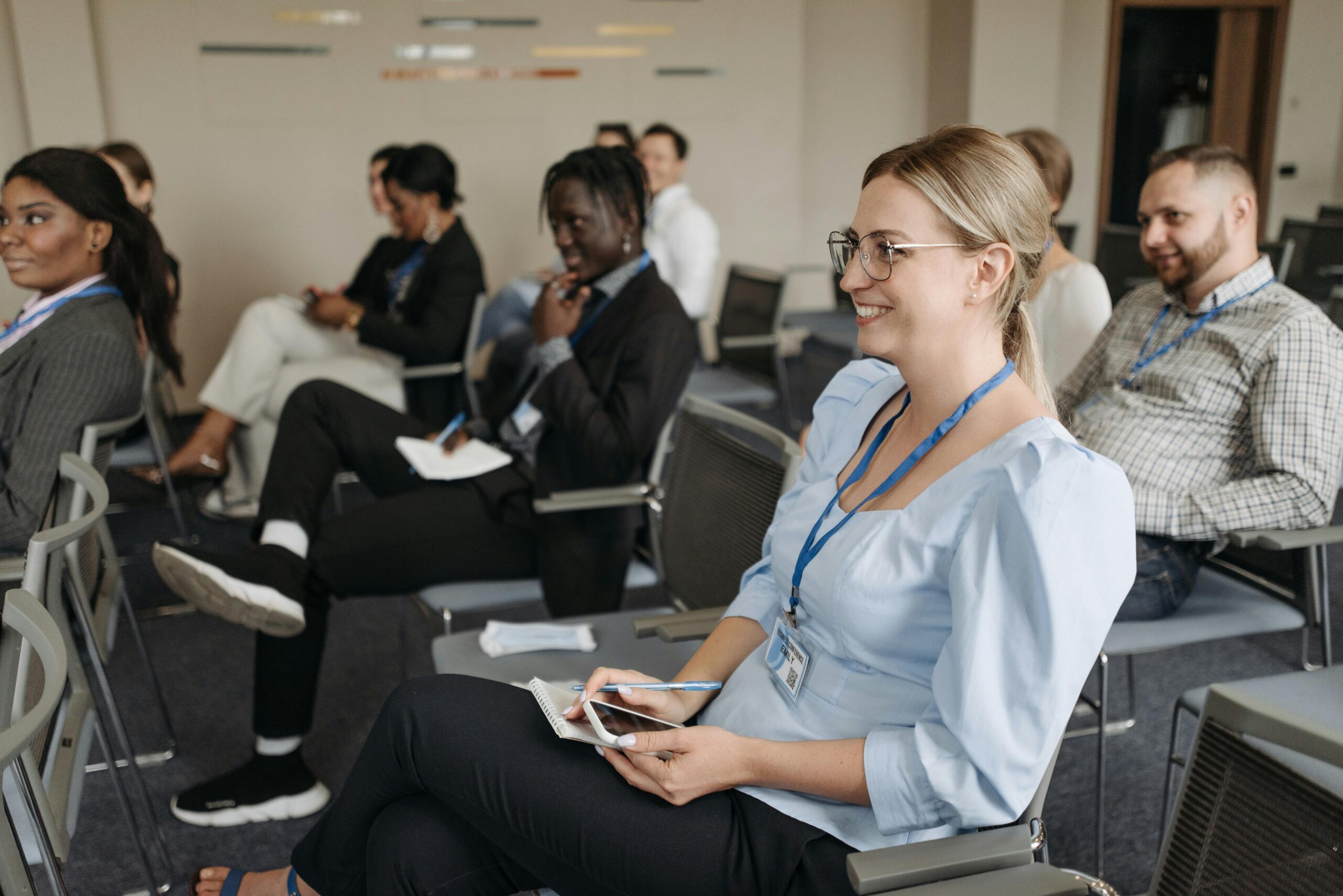 A woman sitting in a meeting room.