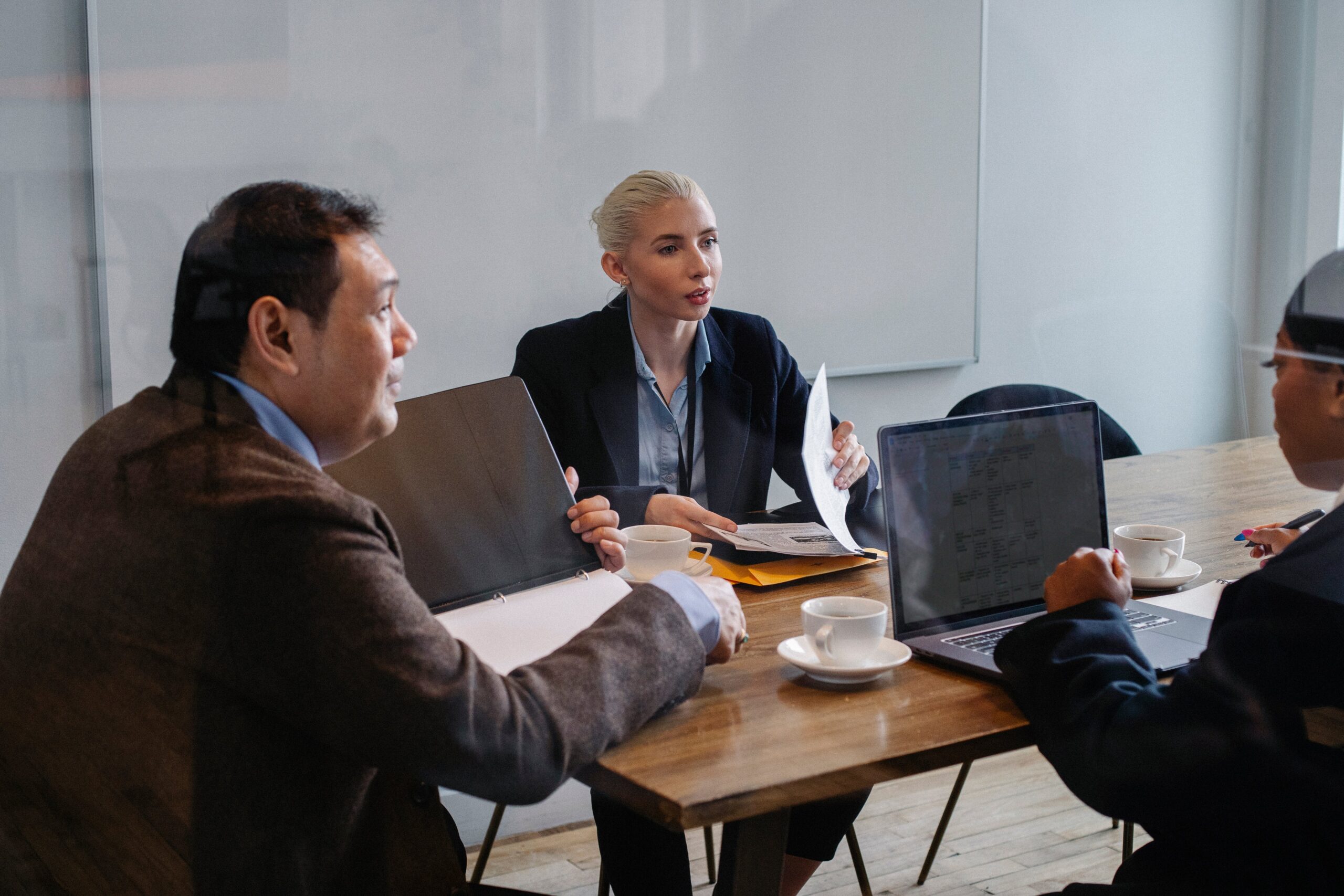 A group of coworkers in the middle of a discussion.